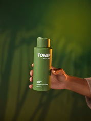 Hand Holding TONE Woodland Oak and Cedar Hydrating Body Wash