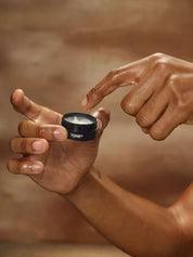 Hand Using TONE Coconut Lip Balm